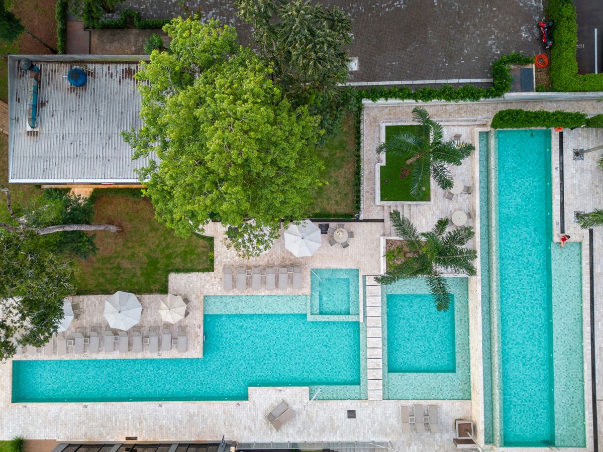 Aerial view of a luxury pool complex with spa